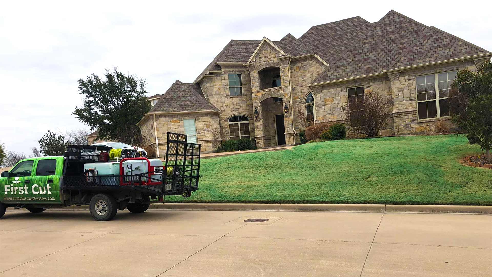 First Cut Lawn Services work truck at a home in Saginaw, Texas.