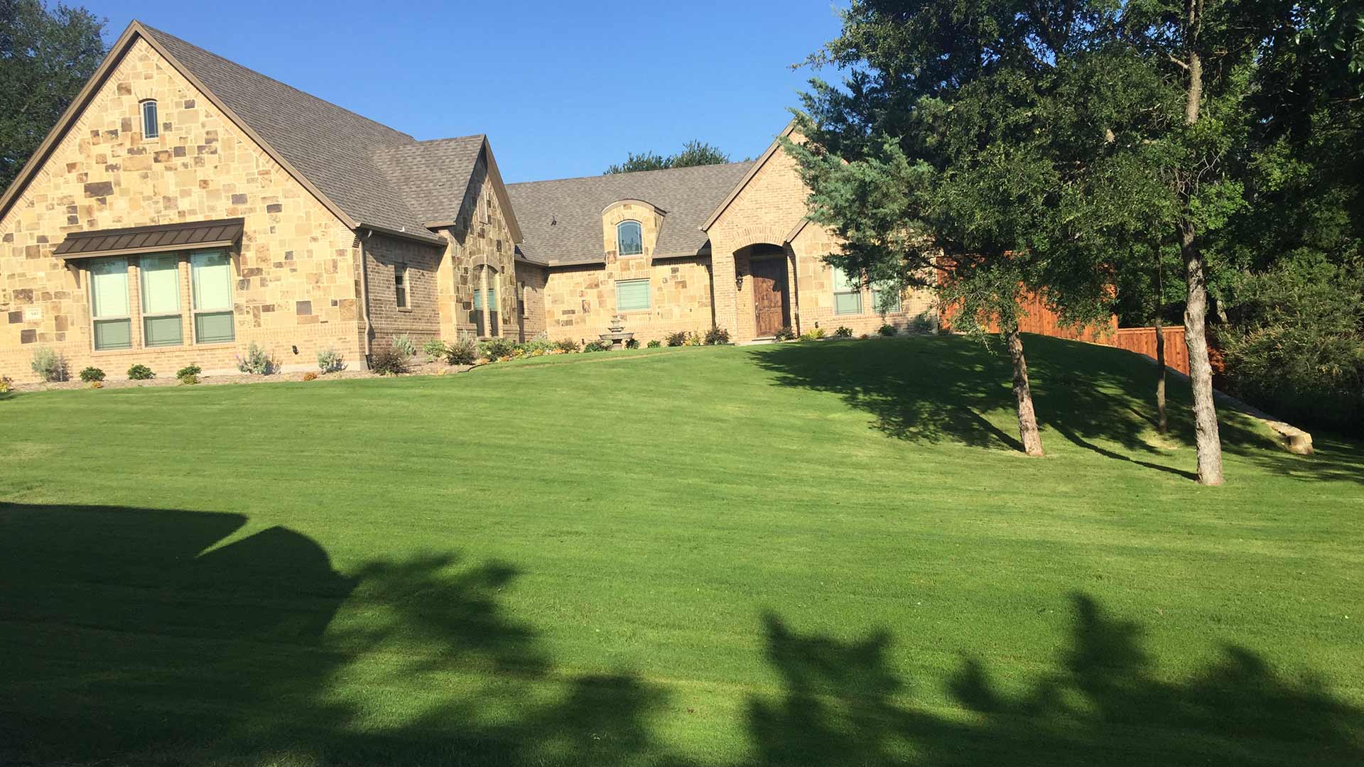Home in Keller, TX with a healthy, green lawn.