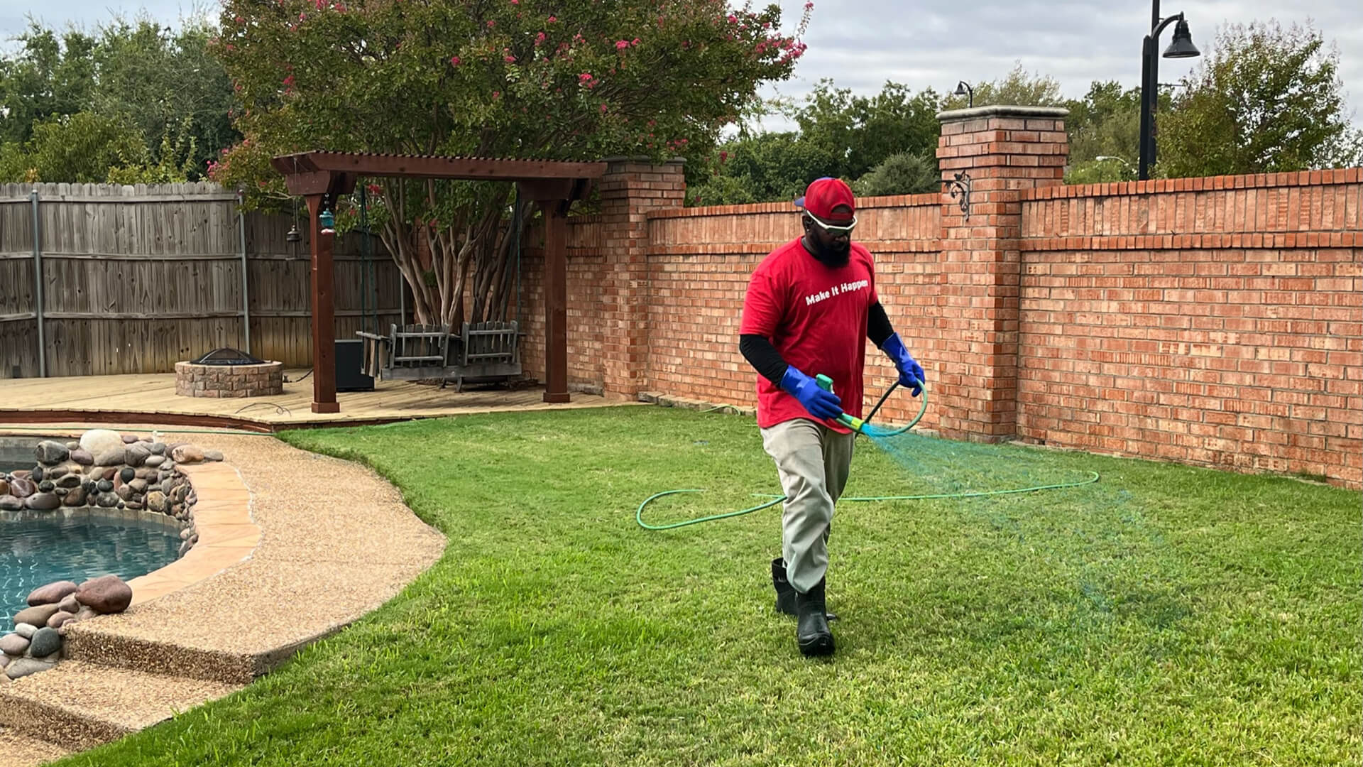 First Cut Lawn Services worker spraying a lawn in Keller, TX.